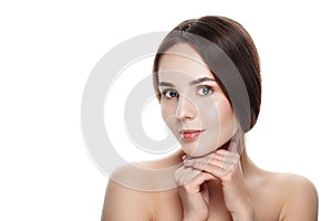 Closeup Beautiful face of young woman with clean fresh skin. Portrait woman touch her face by hands with beautiful blue eyes on w