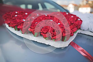 Closeup of a beautiful flower decoration on a wedding car