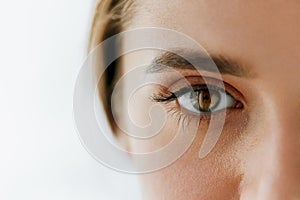 Closeup Of Beautiful Girl Eye And Eyebrow With Natural Makeup photo