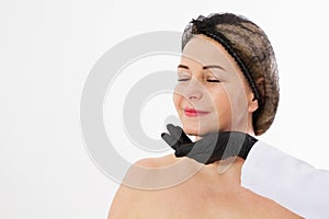 Closeup beautiful middle-aged blonde female and doctor hands isolated on white background. Collagen, Selective focus female face