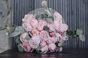 Closeup of beautiful pink rose bouquet held by a gracious bride