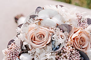 Closeup of beautiful pink rose bouquet held by a gracious bride