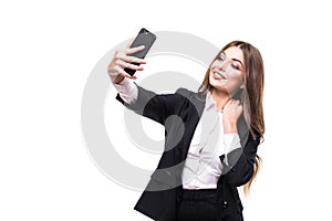 Closeup of beautiful playful business woman making selfie photo on white background and looking at camera