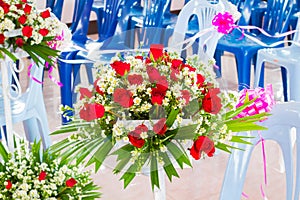 Closeup beautiful wedding flower arrangement of seats along the