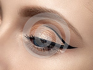 Closeup of beautiful woman eye with fashion makeup