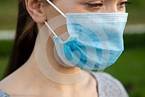 Closeup of Beautiful Woman In A Medical Mask