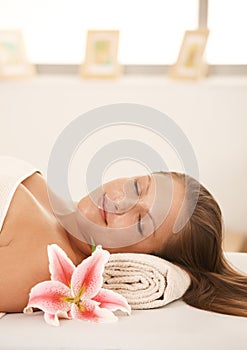 Closeup of beautiful woman sleeping on massage bed