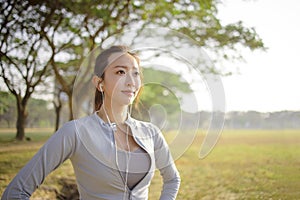 Closeup beautiful young woman face before running in the park at  morning