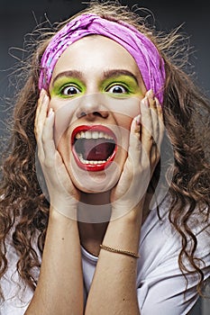 Closeup of beautiful young woman screaming