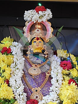 Beautifully decorated goddess Vara Mahalakshmi statue during festival at home photo