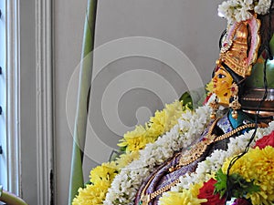 Beautifully decorated goddess Vara Mahalakshmi statue during festival at home photo