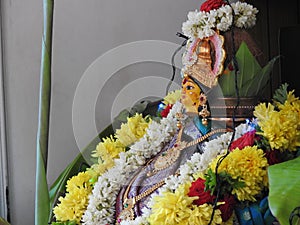 Beautifully decorated goddess Vara Mahalakshmi statue during festival at home photo