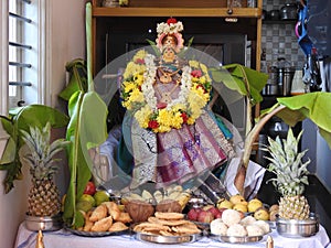 Beautifully decorated goddess Vara Mahalakshmi statue during festival at home photo