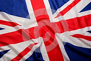 Closeup beautifully wavingof UK British flag Union Jack flag background