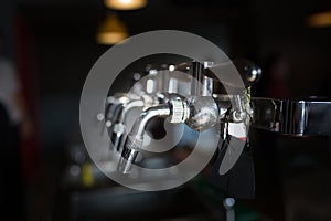 Closeup beer cold tap in pub