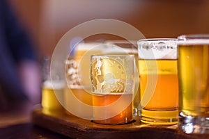 Closeup of a beer flight at brewery in sunlight