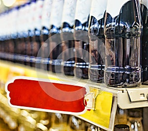 The concept: trade in a supermarket, the action, sale. Closeup: beer, wine or drinks without alcohol on the shelves of the superma