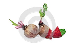 Closeup beetroot (beet root) and cut in half sliced isolated on white background