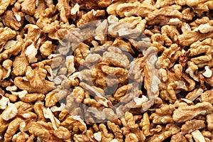 Closeup of big shelled walnuts pile. Nuts are a source of vegetable protein