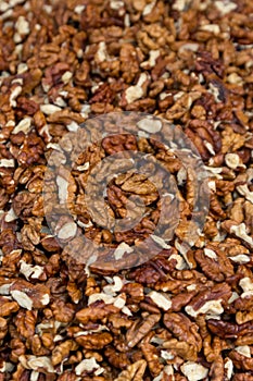 Closeup of big shelled walnuts pile. Selective focus