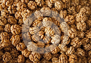 Closeup of big shelled walnuts pile. Walnuts close-up. Ripe and tasty peeled nuts big shelled walnuts pile