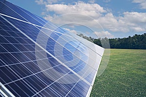 Closeup of big solar pannels leaning diagonally at a field