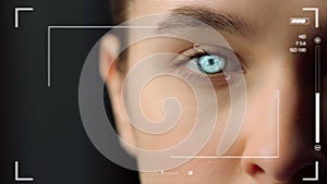 Closeup biometrical vision scanning system inspecting woman eye identifying photo