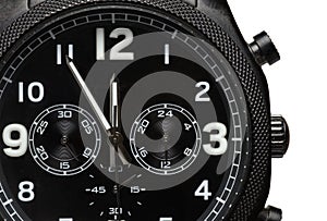 Closeup black dial chronograph wrist watch white background