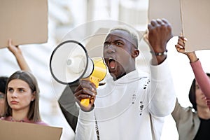 Closeup of black motivated guy leading group of strikers photo