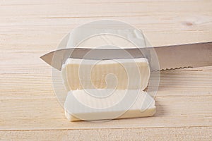 Mozzarella Cheese Being Sliced Into Servings