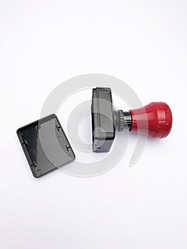 closeup black red plastic stamp