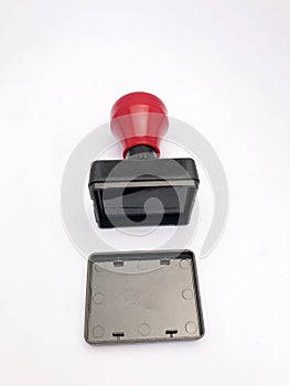 closeup black red plastic stamp