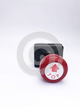 closeup black red plastic stamp