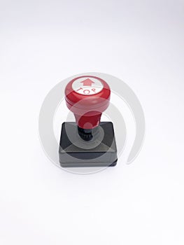 closeup black red plastic stamp