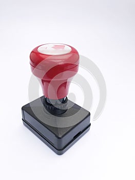 closeup black red plastic stamp