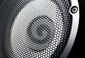 Closeup of a black speaker sub woofer photo