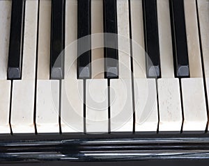 Black and white keys on old ivory keyboard of grand piano