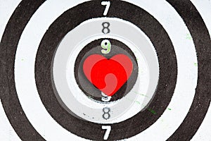 Closeup black white target with heart bullseye as love background