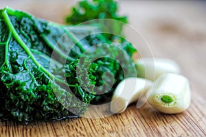 Closeup of Blanched Kale and Garlic Cloves