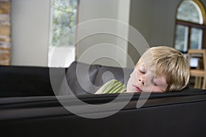Closeup Of Blond Boy Sleeping On Sofa