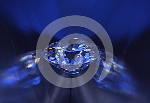 Closeup blue diamond in blue light. photo