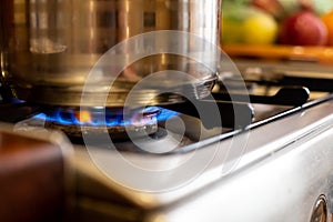 closeup blue flame burning gas. cooking on a stove