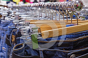 Closeup of blue jeans in a shop.