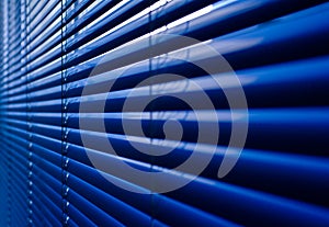 Closeup of blue shutter at an office building