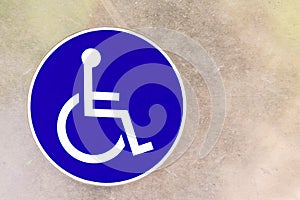 Closeup blue sign white symbol wheelchair disability