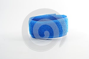 Closeup of a blue velcro strap isolated on white background