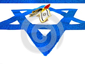 Closeup on Blue White Israeli Flag and Izkor Pin in the Center of Star Of David Symbol