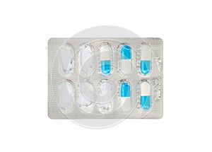 Closeup blue and white pills in blister pack isolated on white background with clipping path