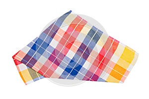 Closeup of a blue, white, red, yellow, and orange checkered napkin or tablecloth isolated on white background. Dishtowels are