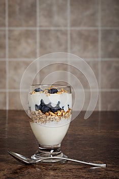 Closeup blueberry parfait with spoon